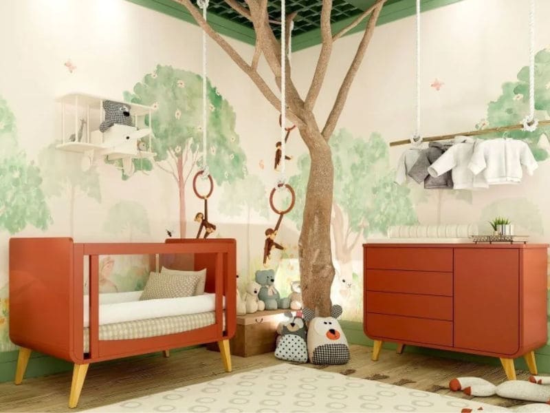 quarto de bebê com uma árvore fake para complementar a decoração